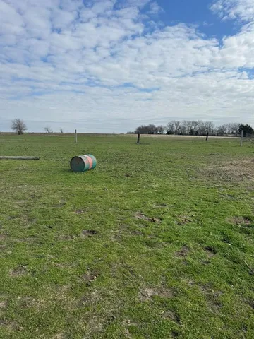 a view of a field with an outdoor space