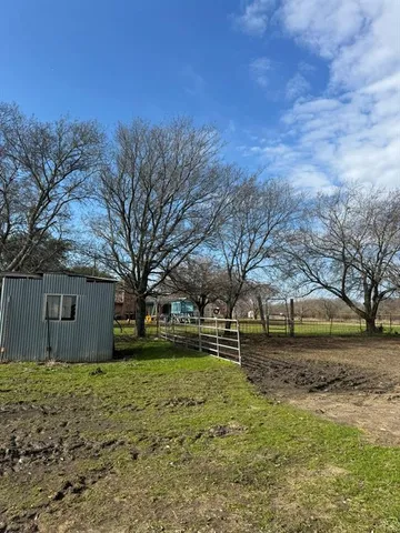 a view of house with yard