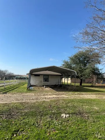 a view of outdoor space with deck and yard