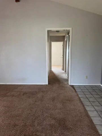 a view of an empty room and window