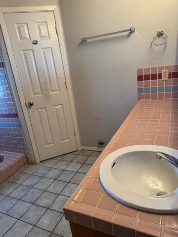 a view of a room with wooden floor and cabinet