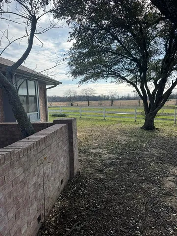 a view of a yard in front of a house