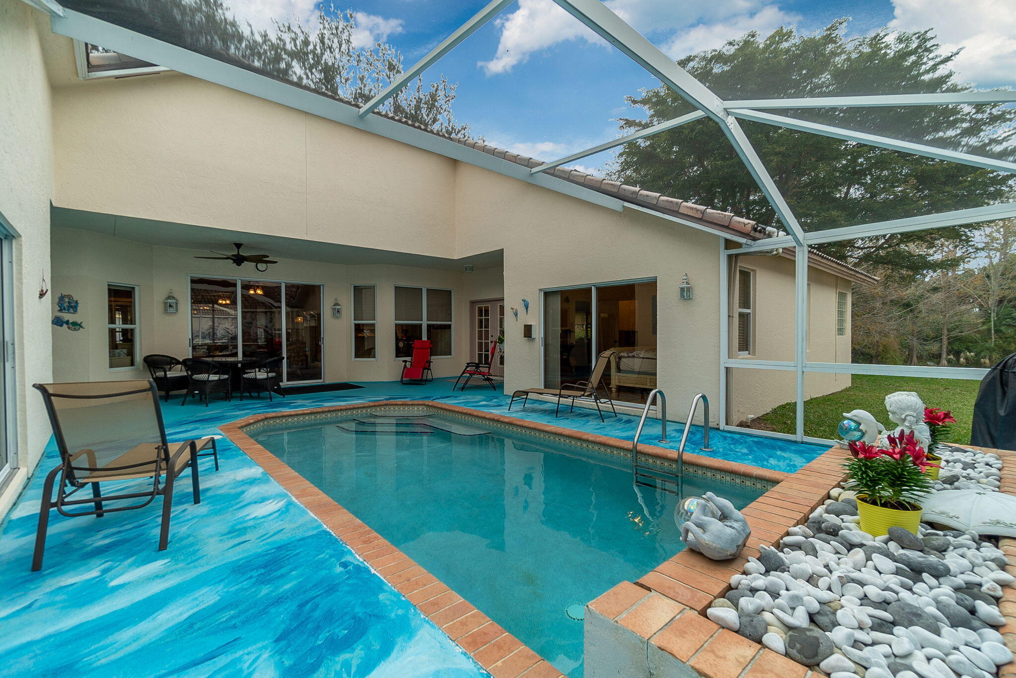 a view of a patio with swimming pool table and chairs