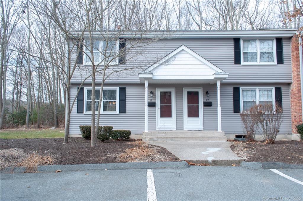 81 East Pattagansett Road, Unit 11 East Lyme, CT 06357 - Photo 1 of 1 a front view of a house with garden