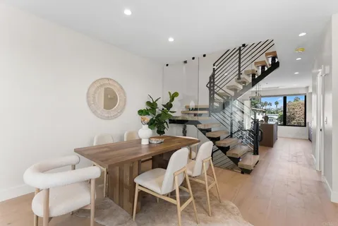 a view of a livingroom with furniture and a potted plant