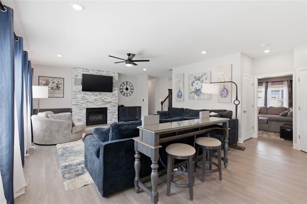 359 Juniper Way Canonsburg, PA 15317 - Photo 12 of 42 a living room with furniture a fireplace and a flat screen tv