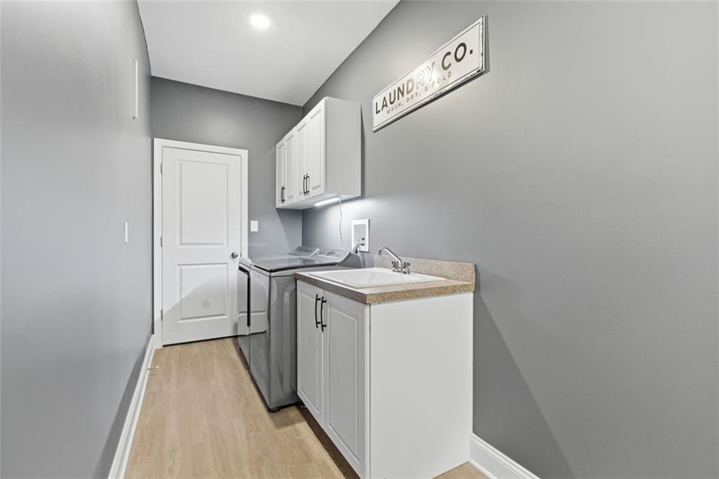 359 Juniper Way Canonsburg, PA 15317 - Photo 18 of 42 a utility room with cabinets washer and dryer