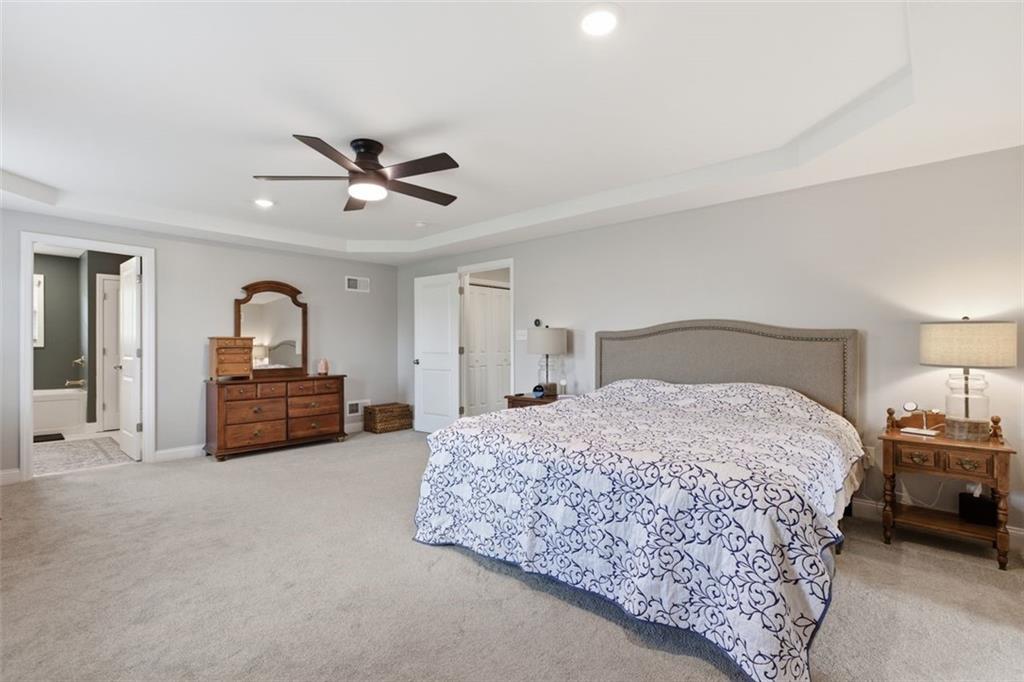 359 Juniper Way Canonsburg, PA 15317 - Photo 28 of 42 a bedroom with a bed and a chandelier