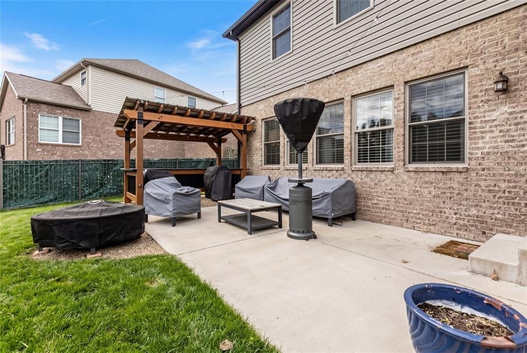 359 Juniper Way Canonsburg, PA 15317 - Photo 40 of 42 a view of a patio with table and chairs with wooden fence