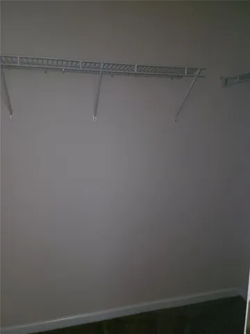 a bathroom with a granite countertop sink and mirror