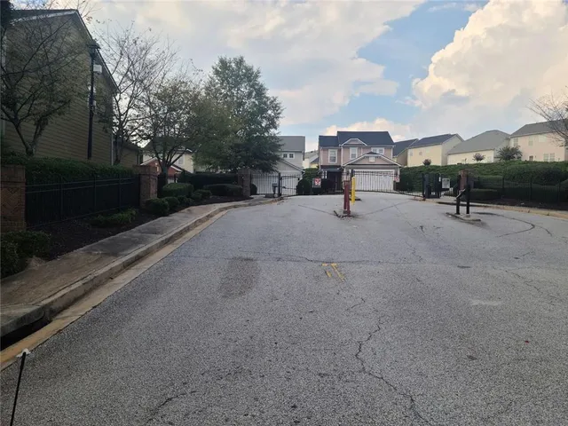 a view of empty room with wooden floor a fireplace
