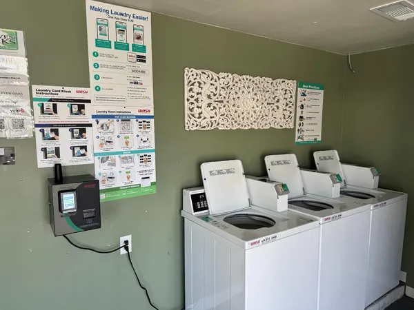 a bedroom with furniture a flat screen tv and a fireplace