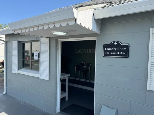 a view of a swimming pool with outdoor seating