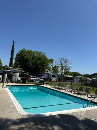 a view of backyard with trampoline