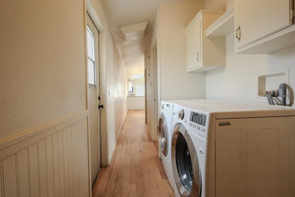 a view of storage and utility room with washer and dryer