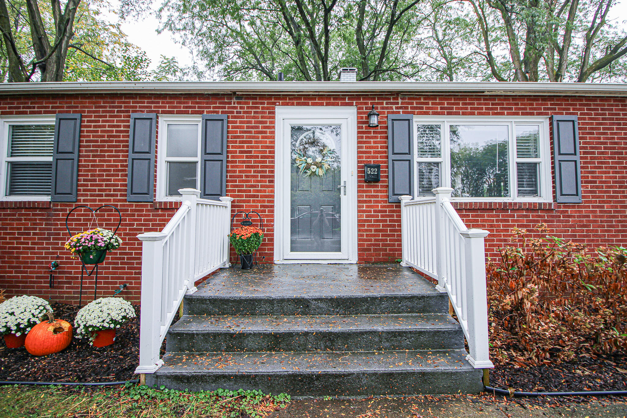 522 Dexter Drive Crown Point, IN 46307 - Photo 3 of 21 a front view of a house with a garden