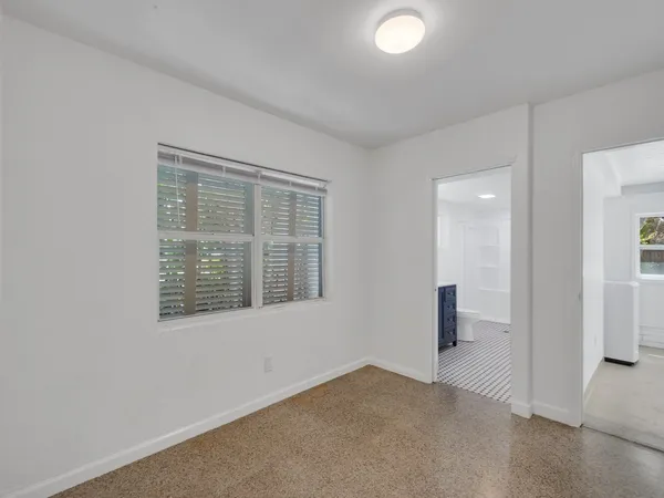 an empty room with windows