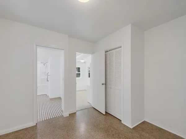 a view of an empty room with a window