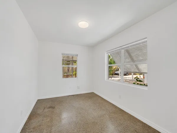 a view of an empty room with a window