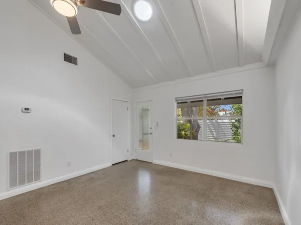 an empty room with windows