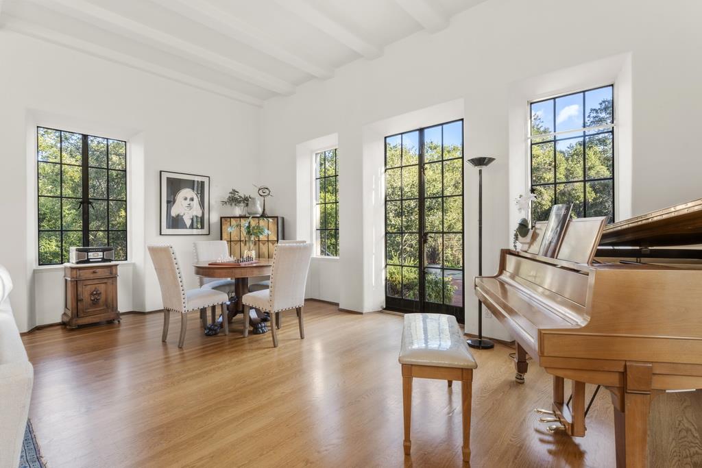 440 Gerona Road Stanford, CA 94305 - Photo 17 of 78 a view of a livingroom with furniture wooden floor and a large window