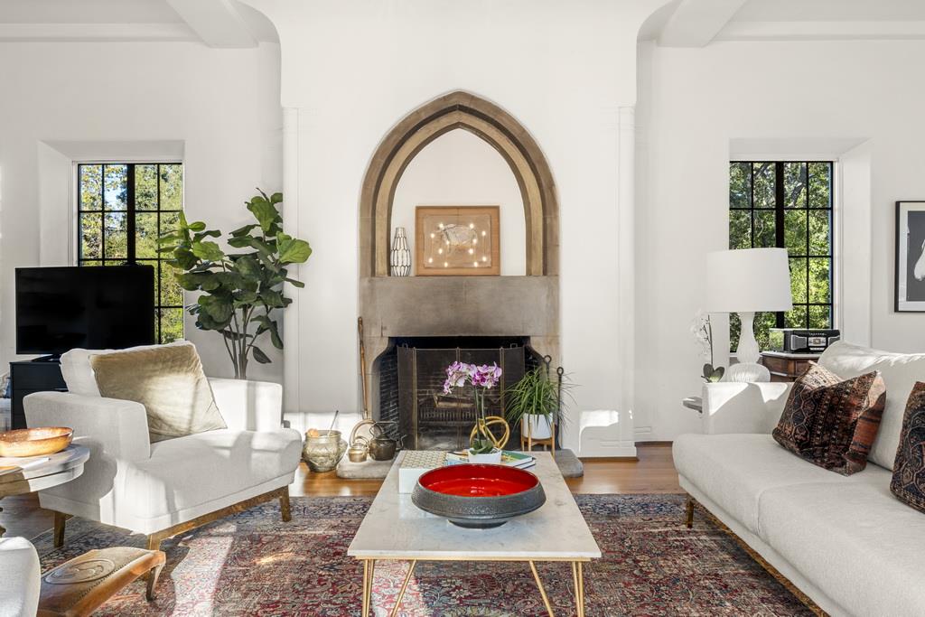 440 Gerona Road Stanford, CA 94305 - Photo 18 of 78 a living room with furniture a potted plant and a fireplace