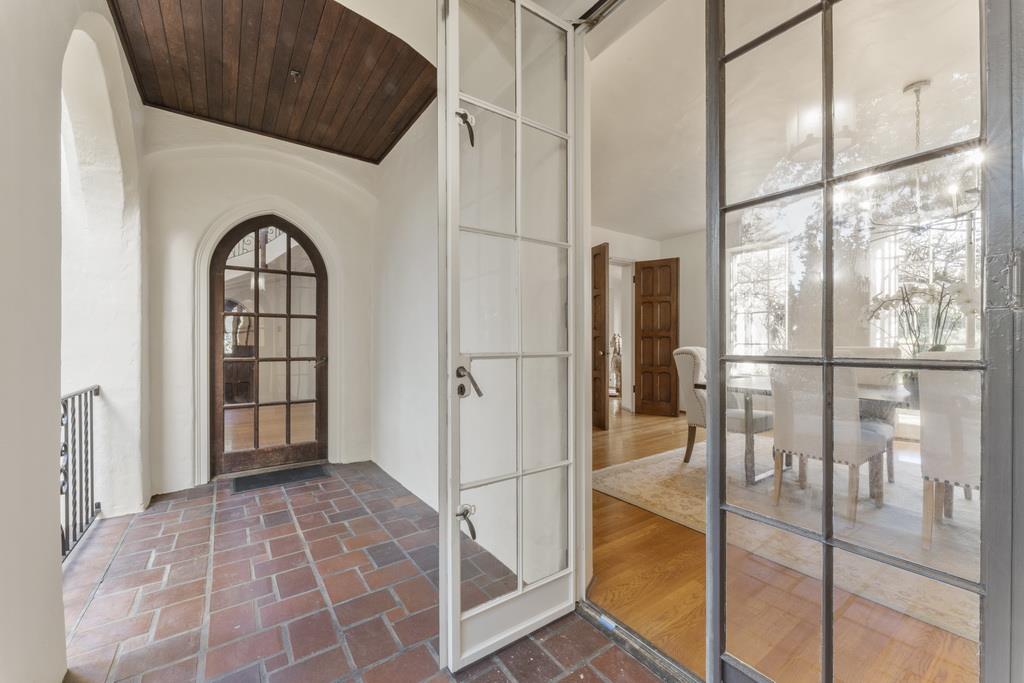 440 Gerona Road Stanford, CA 94305 - Photo 22 of 78 a view of an entryway with a floor to ceiling window and fire place