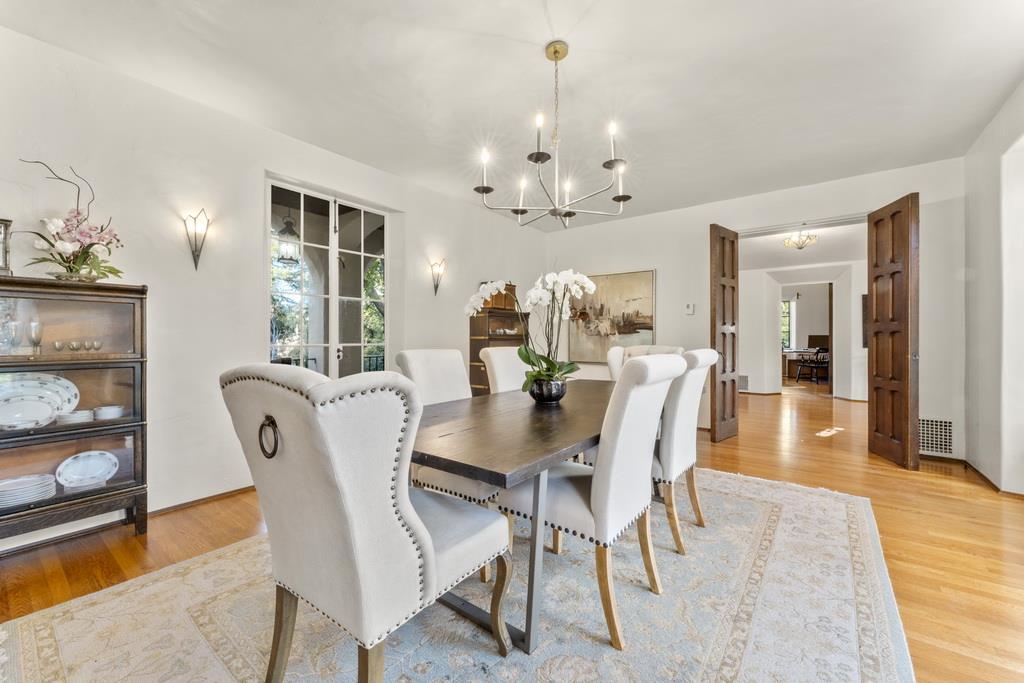 440 Gerona Road Stanford, CA 94305 - Photo 23 of 78 a view of a dining room with furniture wooden floor and chandelier