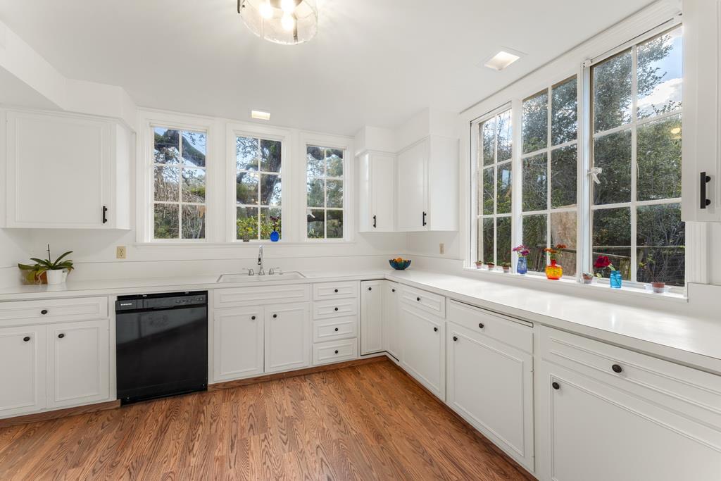 440 Gerona Road Stanford, CA 94305 - Photo 28 of 78 a large white kitchen with cabinets