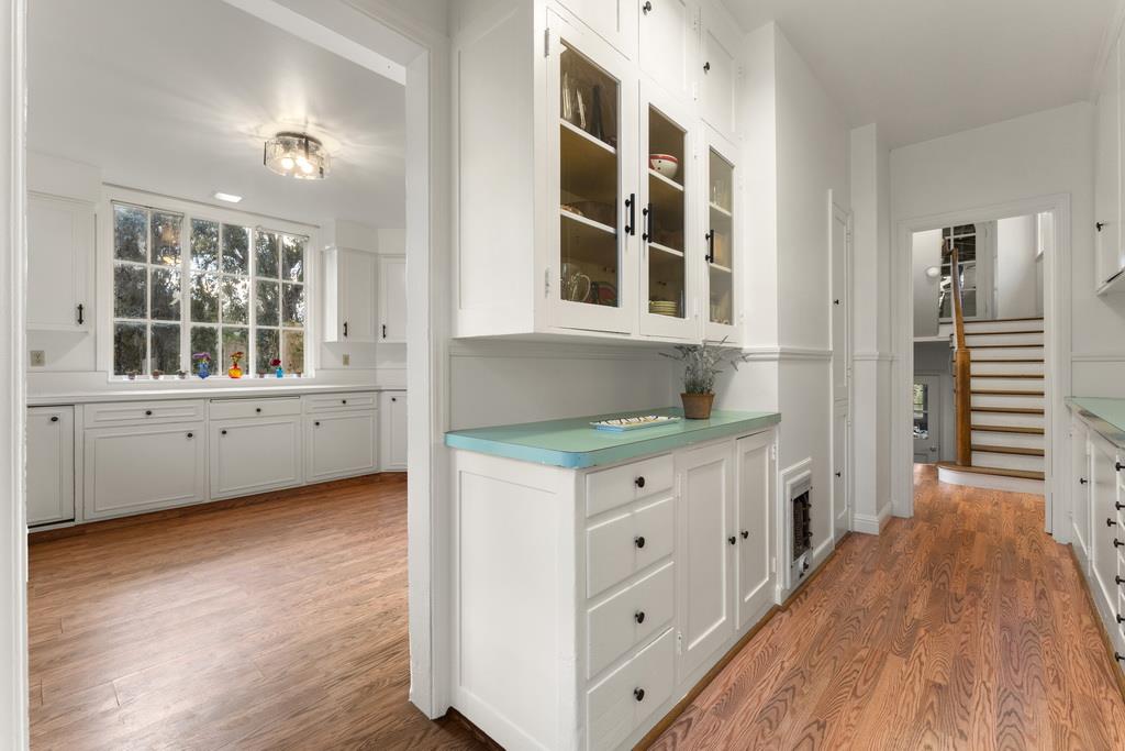 440 Gerona Road Stanford, CA 94305 - Photo 30 of 78 a kitchen with granite countertop a stove and a wooden floor