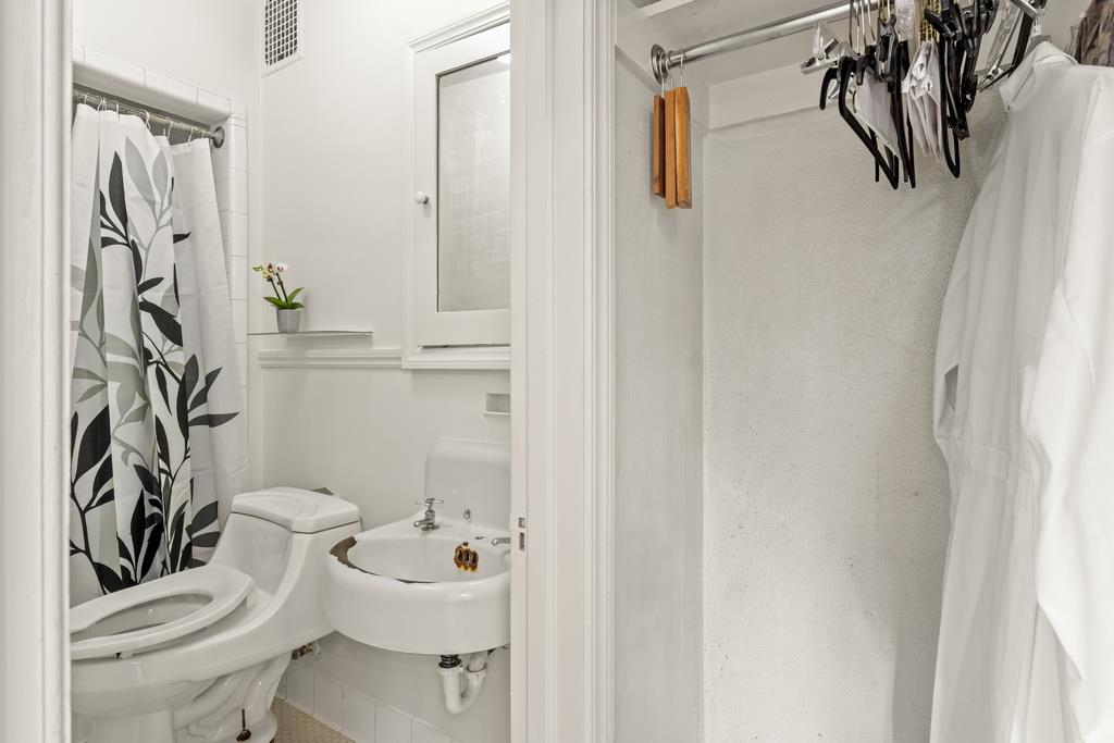 440 Gerona Road Stanford, CA 94305 - Photo 36 of 78 a bathroom with a sink a toilet and shower curtain