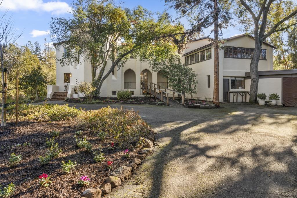 440 Gerona Road Stanford, CA 94305 - Photo 5 of 78 a view of a white house with a large tree in front of it