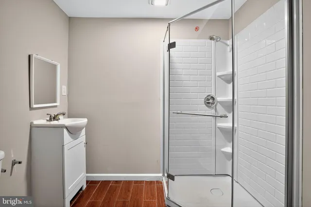 a bathroom with a bathtub and shower