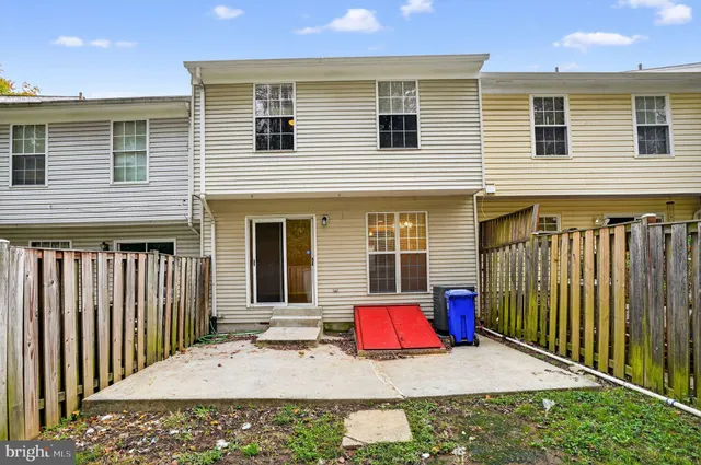 a view of a house with wooden floor and wooden fence