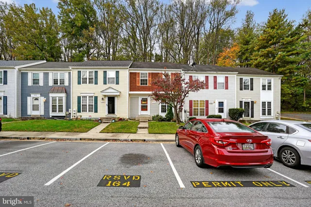 a front view of residential houses with yard