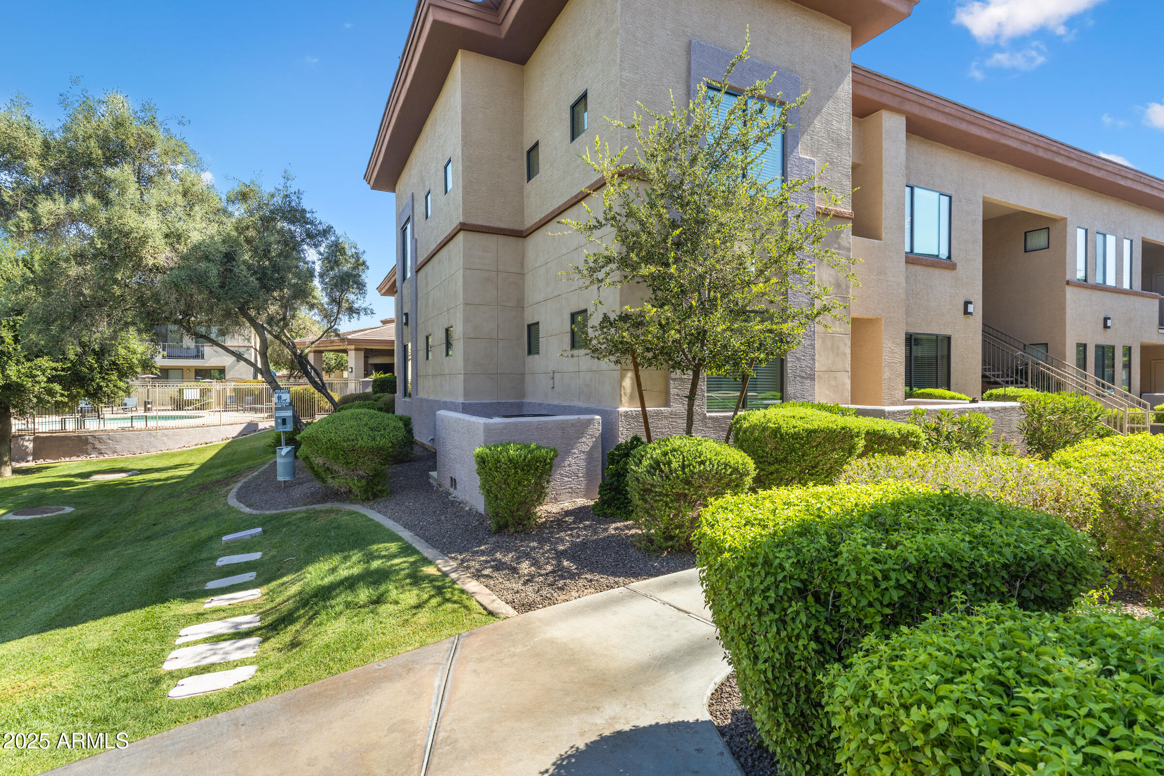 3330 South Gilbert Road, Unit 1013 Chandler, AZ 85286 - Photo 3 of 38 a view of a house with a garden