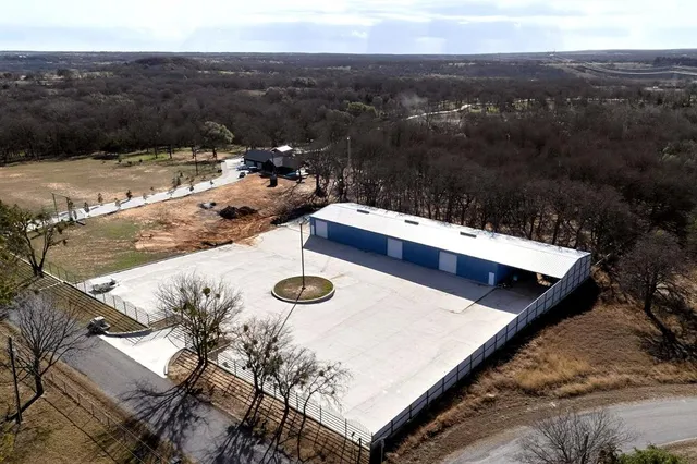 a view of roof deck with patio and yard