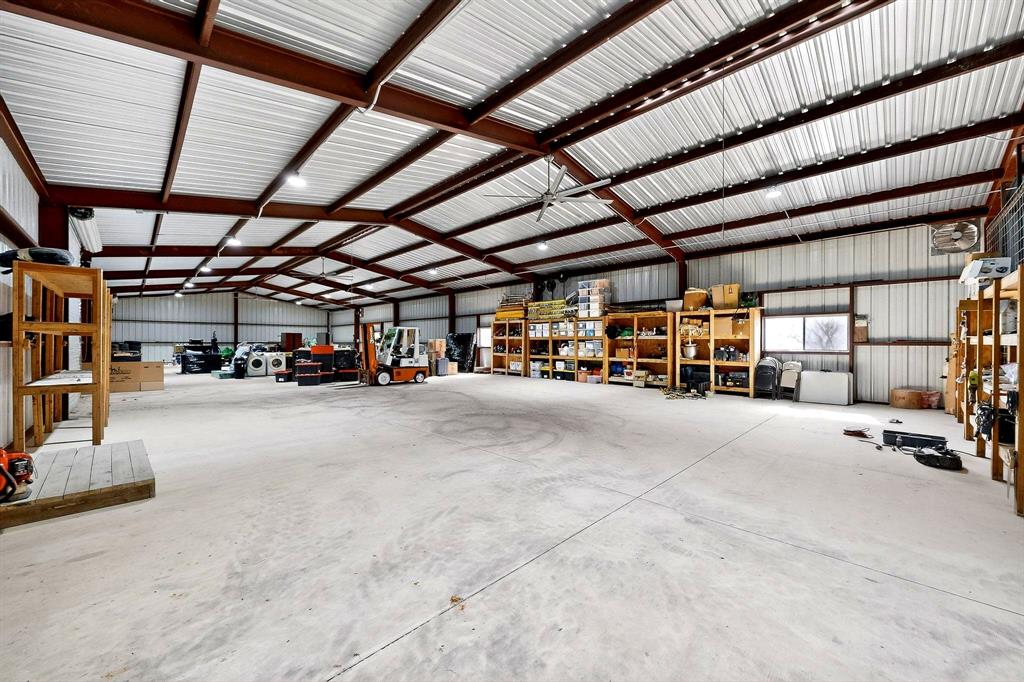 3095 Carter Road Springtown, TX 76082 - Photo 14 of 27 a view of parking garage with lots of storage