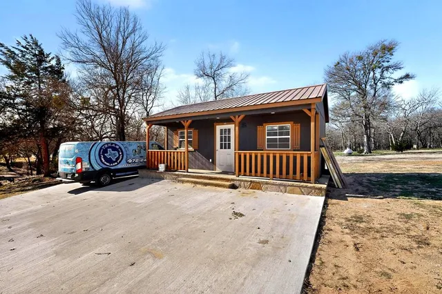 a front view of a house with parking yard