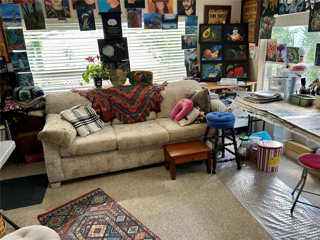 25646 Bass Road Astor, FL 32102 - Photo 22 of 48 a living room with furniture and a window