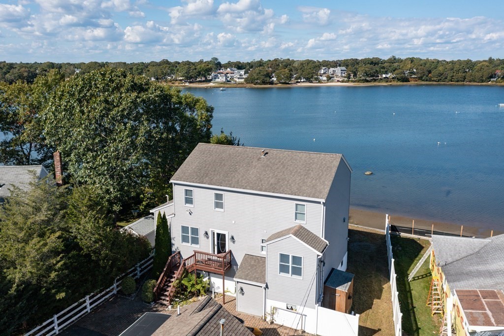 22 Cove Street Wareham, MA 02558 - Photo 25 of 35 a aerial view of a house with a lake view
