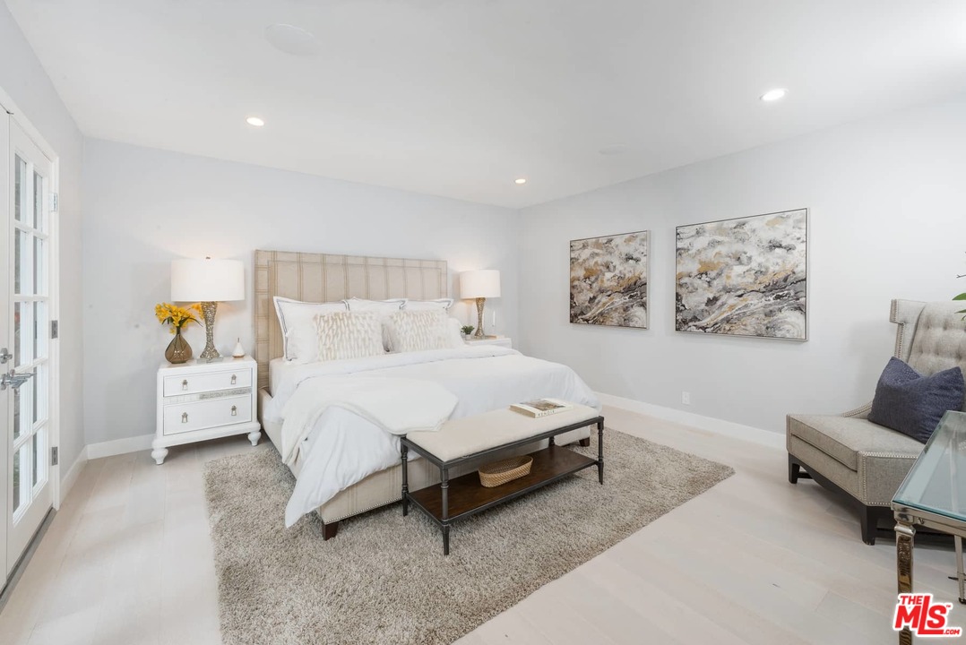 1075 Moraga Drive Los Angeles, CA 90049 - Photo 11 of 24 a bed room with a bed and a couch