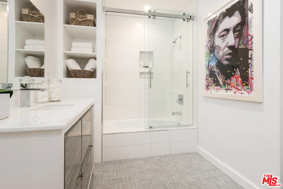 1075 Moraga Drive Los Angeles, CA 90049 - Photo 16 of 24 a bathroom with a bathtub and a shower