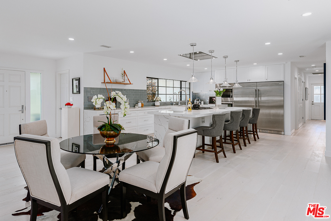 1075 Moraga Drive Los Angeles, CA 90049 - Photo 5 of 24 a view of a dining room with furniture