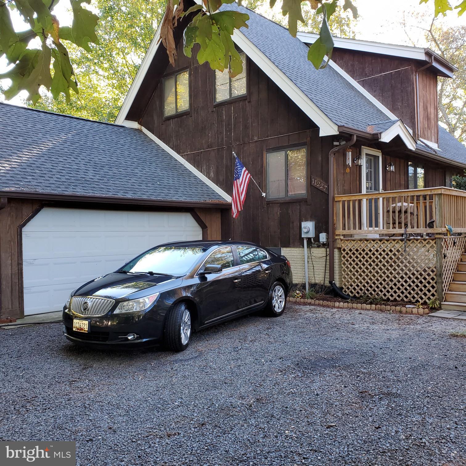 11227 Rawhide Road Lusby, MD 20657 - Photo 2 of 30 a car parked in front of a house