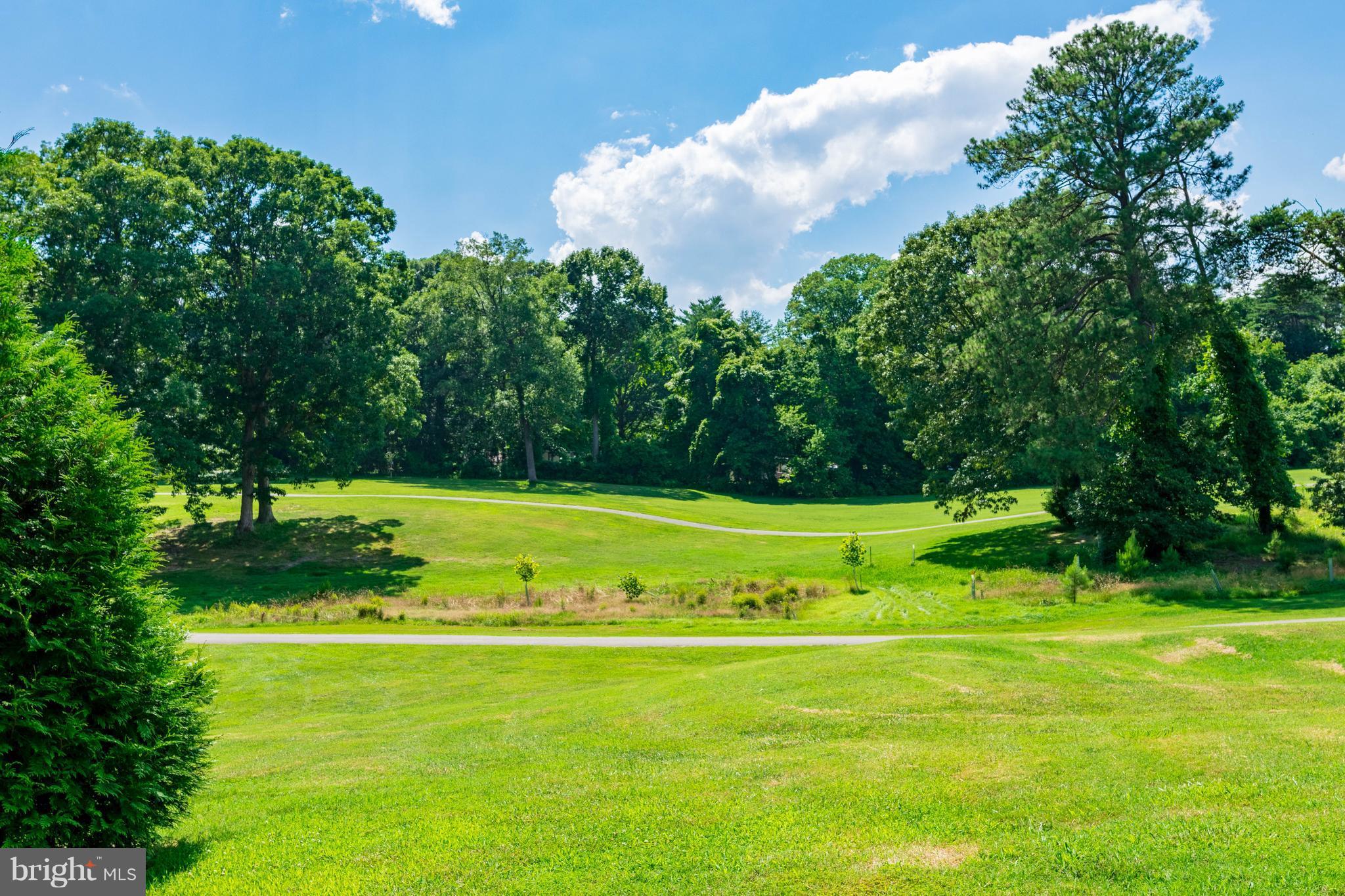 11227 Rawhide Road Lusby, MD 20657 - Photo 21 of 30 a view of a golf course with a park