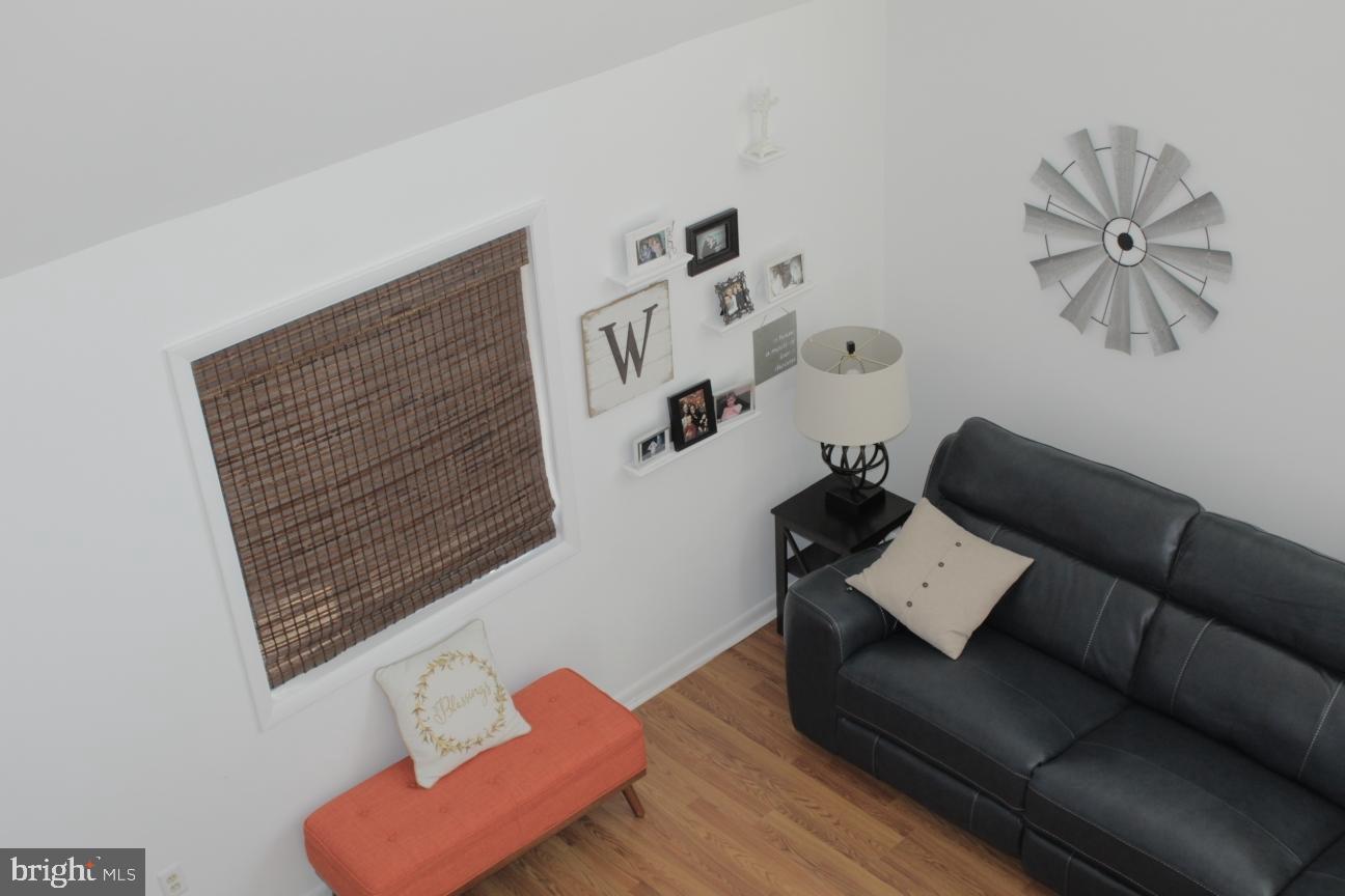 11227 Rawhide Road Lusby, MD 20657 - Photo 5 of 30 a living room with furniture and a wooden floor
