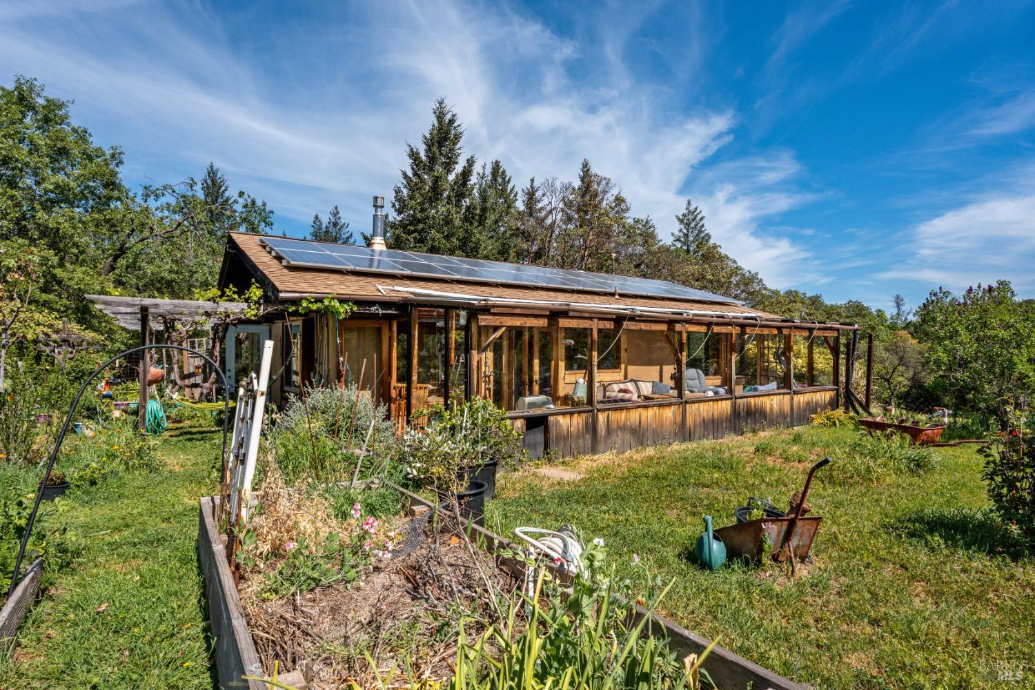 3751 Low Gap Road Ukiah, CA 95482 - Photo 16 of 22 a view of a house with backyard sitting area and garden
