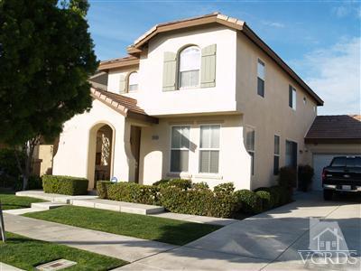 2093 Ribera Drive Oxnard, CA 93030 - Photo 1 of 9 a front view of a house with garden