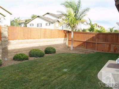 2093 Ribera Drive Oxnard, CA 93030 - Photo 4 of 9 a view of a backyard with a garden and plants